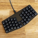 Illustration for article titled Tiny Ergonomic Keyboard Gets It Done With Only 44 Keys